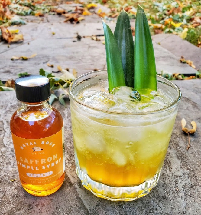 Saffron Royal Rose Simple Syrup pictured in a spiritfree cocktail